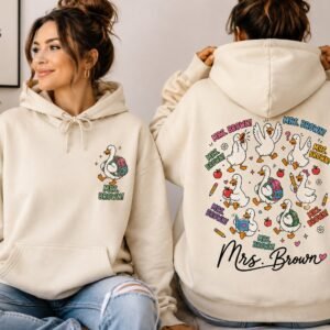 Cream personalized teacher hoodie with silly geese and a custom name printed on the back
