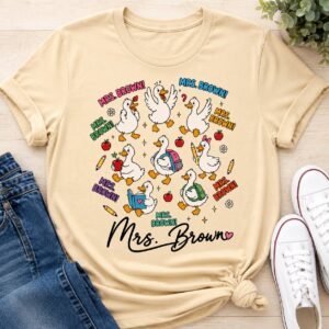 Natural cream t-shirt with cartoon geese shouting a teacher name and Mrs. Brown in script
