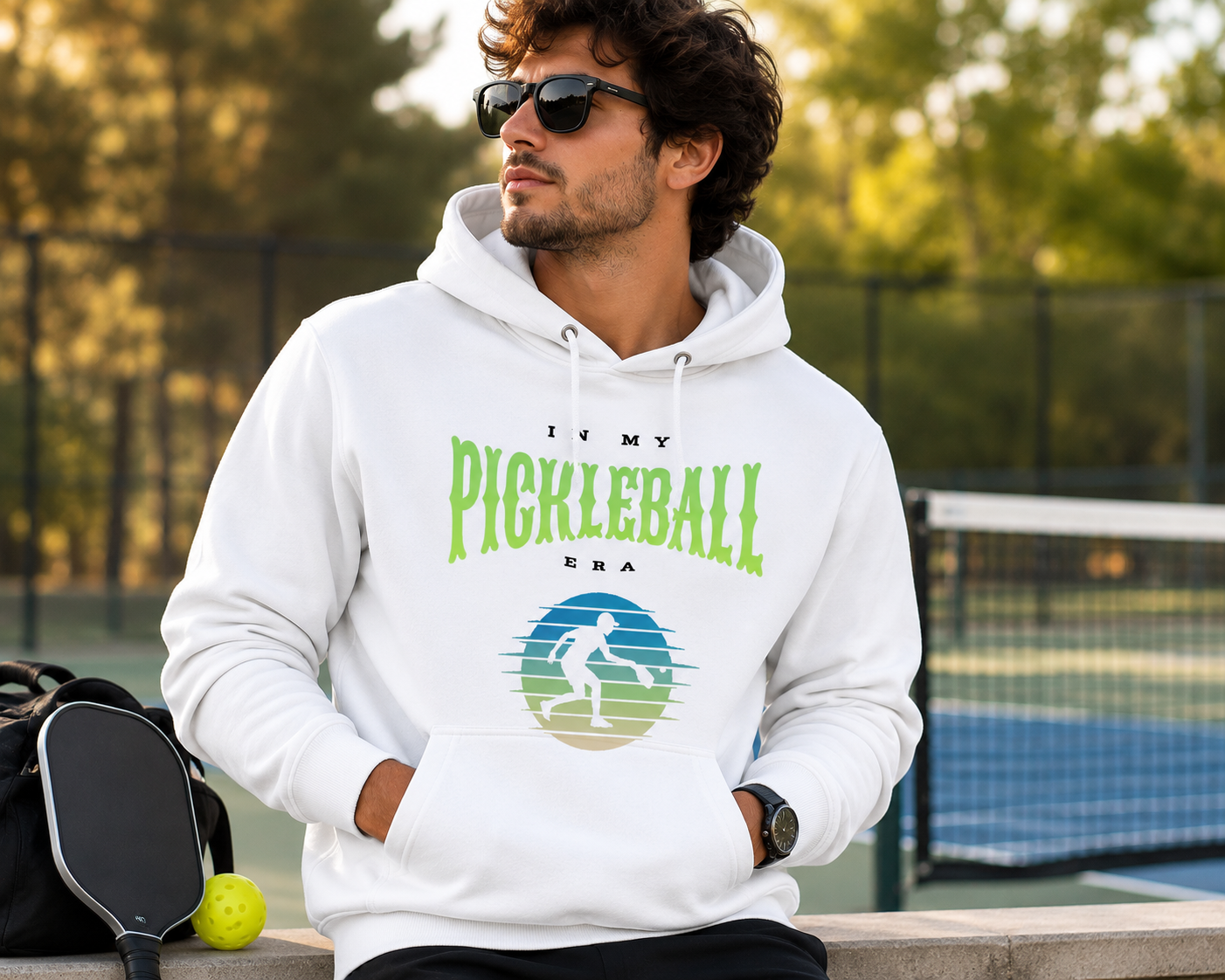 In My Pickleball Era hoodie worn by model, seated pose